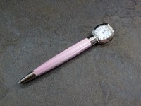 Lot 70 - A Cartier guilloche enamel clock pen, the pink...