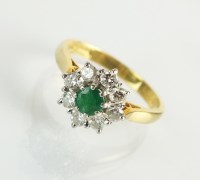 Lot 88 - An 18ct gold emerald and diamond cluster ring,...