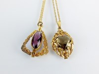 Lot 91 - A 9ct gold smoky quartz pendant, suspended...