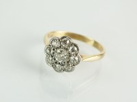 Lot 114 - A nine stone diamond floral cluster ring,...