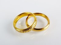 Lot 115 - Two 22ct gold wedding bands, total weight...