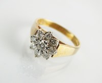 Lot 118 - A 9ct gold nine stone diamond floral cluster...