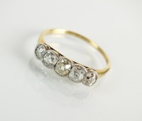 Lot 127 - A five stone diamond ring, designed as five...