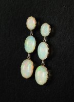 Lot 131 - A pair of graduated opal ear pendants, each...