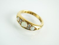 Lot 166 - An 18ct gold seven stone opal and diamond ring,...