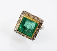 Lot 179 - An emerald and diamond cluster ring, designed...