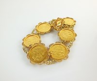 Lot 203 - A half sovereign set bracelet, comprised of...