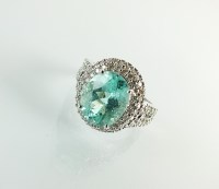 Lot 206 - A 18ct white gold Paraiba style tourmaline and...