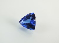 Lot 207 - An unmounted trilliant cut tanzanite, with...