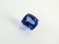 Lot 208 - An unmounted cushion cut tanzanite, with...