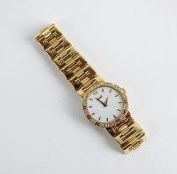 Lot 225 - A Lady's 18ct gold and diamond set Piaget Lady...