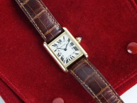 Lot 239 - A Lady's 18ct yellow gold Cartier Tank quartz...