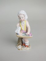 Lot 30 - A Meissen porcelain figure of a child holding...