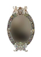 Lot 32 - A large oval porcelain florally encrusted...