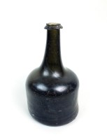 Lot 40 - A green glass mallet shape wine bottle, first...