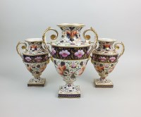 Lot 41 - A garniture of three Derby porcelain vases,...