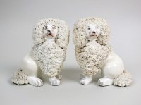 Lot 70 - A pair of Staffordshire porcelainous poodles,...