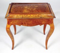 Lot 168 - A Louis XV style walnut and inlaid jardiniere...