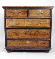 Lot 180 - An elm cross banded chest of drawers, early...