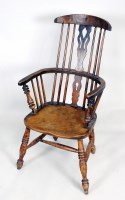 Lot 200 - An ash and elm comb back Windsor armchair,...