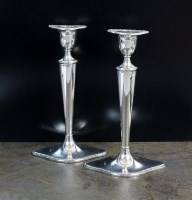 Lot 38 - A pair of silver mounted candlesticks, William...