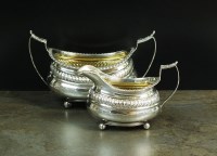 Lot 73 - A matched silver sugar bowl and cream jug,...