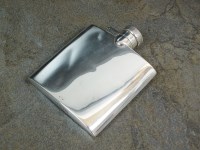 Lot 74 - An Asprey & Co silver hip flask, Chester 1937,...