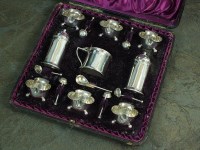 Lot 78 - A cased Victorian nine piece silver cruet set,...