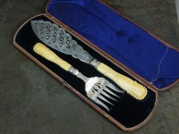 Lot 99 - A Victorian cased pair of silver fish servers,...