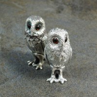 Lot 129 - A pair of novelty silver owl salt and pepper...