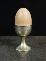 Lot 135 - A silver and gilt novelty musical easter egg...