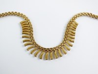 Lot 170 - A 9ct yellow gold brick link and fringe...