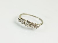 Lot 175 - A five stone graduated diamond ring, the five...