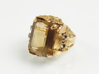 Lot 181 - A large citrine and white stone set dress ring,...