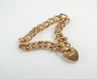 Lot 194 - A yellow metal hollow curb link bracelet, with...