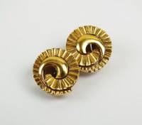 Lot 199 - A pair of yellow metal stylised spiral...