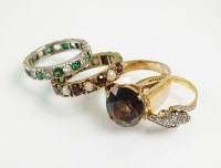 Lot 204 - A graduated three stone diamond ring, the...