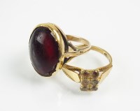 Lot 210 - A red stone cabochon ring, with 18ct gold...