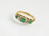 Lot 222 - A Victorian 18ct gold five stone emerald and...