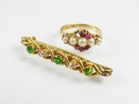 Lot 224 - A demantoid garnet and diamond bar brooch,...