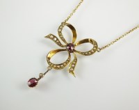 Lot 230 - An early 20th century garnet and seed pearl...