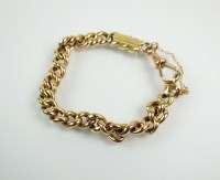 Lot 233 - A yellow metal hollow curb link bracelet, with...