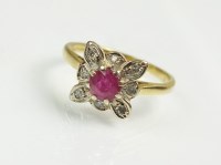 Lot 237 - An 18ct yellow gold ruby and diamond cluster...