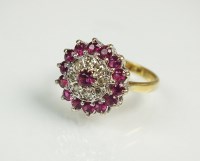 Lot 238 - A ruby and diamond cluster ring, designed as a...