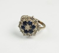 Lot 249 - An 18ct white gold diamond and sapphire...