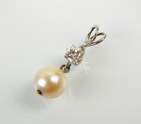 Lot 260 - A cultured pearl and diamond pendant, designed...