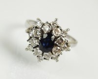 Lot 275 - An 18ct white gold sapphire and diamond...