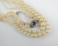 Lot 285 - A graduated two strand cultured pearl necklace,...