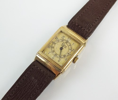 Lot 326 - A 9ct gold Le Coultre Reverso wristwatch, the...