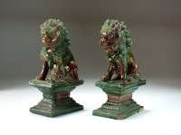 Lot 2 - A pair of Chinese sancai glazed figures of...
